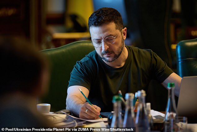 Ukrainian President Volodymyr Zelensky listens at the Mariinskyi Palace in Kiev yesterday during a conference call with Donald Trump and European partners after the Alaska summit