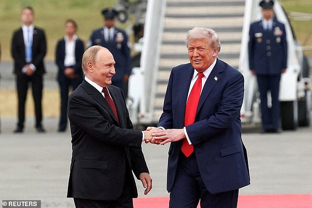 US President Donald Trump shakes hands with Russian President Vladimir Putin as they meet for talks about Ukraine at Joint Base Elmendorf-Richardson in Anchorage, Alaska, on Friday