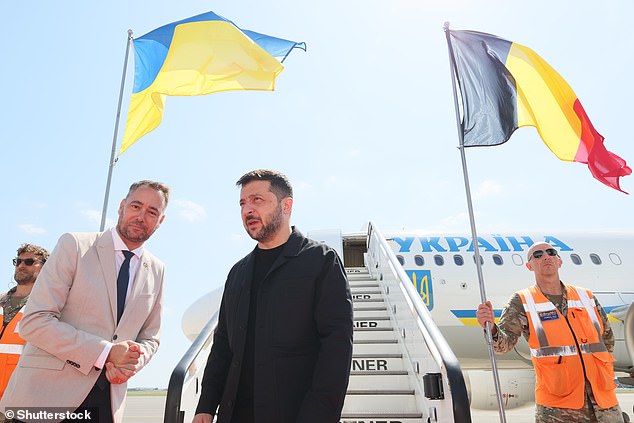 Belgian Foreign Minister Maxime Prevot welcomes Ukraine's President Volodymyr Zelensky to Melsbroek Air Base near Brussels today ahead of a meeting with European leaders