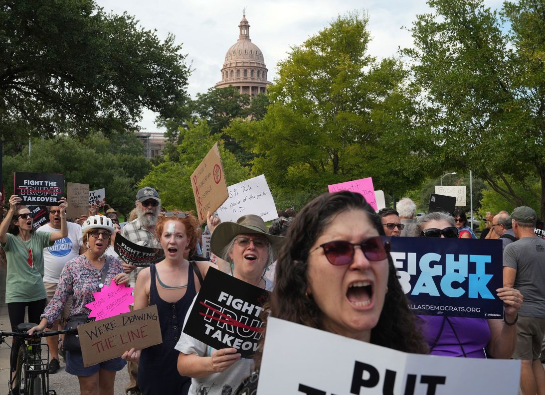 People protest the Republican plan for Congressional redistricting outside the Governor's Mansion in Austin on August 4.