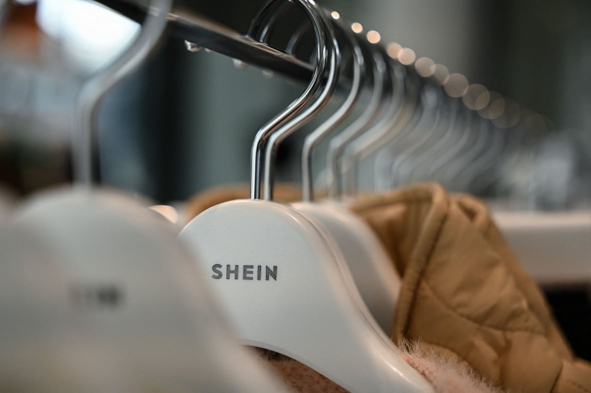 Shein logo on coat hangers during a media preview of the first permanent showroom of Chinese online fast fashion giant Shein in Tokyo.