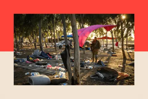 Leon Neal/Getty Images Members of the security forces search for identification and personal effects at the Supernova Music Festival site, where hundreds were killed
