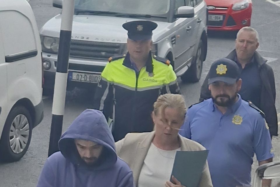 Dylan Feeney (blue hoodie) arriving at Sligo District Court on Monday afternoon.
