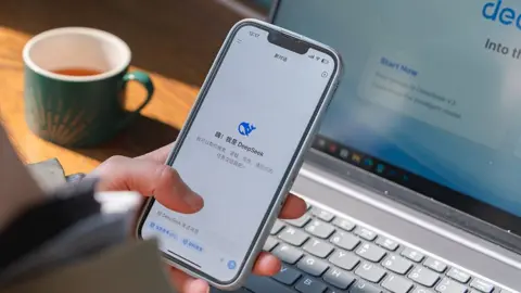 Shutterstock The DeepSeek app from a Chinese AI technology company is displayed on a mobile phone 