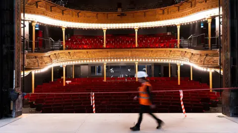 Eoin Carey A photo of the auditorium with red plush seats and gold plasterwork