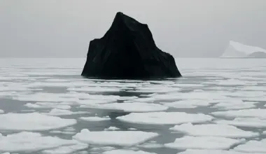 A fisherman discovers a black iceberg off the northeast coast of Canada, leaving scientists in shock.