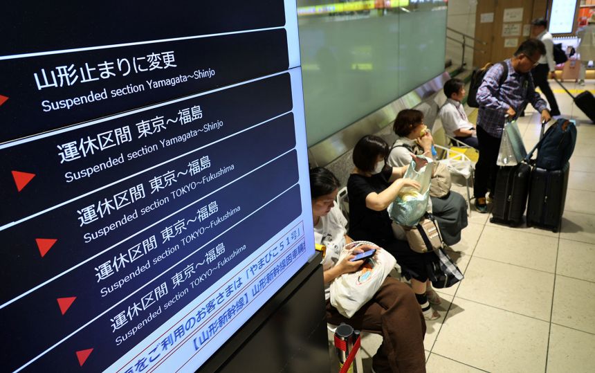 A notice at a Tokyo train station that part of Japan's high-speed bullet train services were temporarily suspended due to tsunami warnings on July 30.