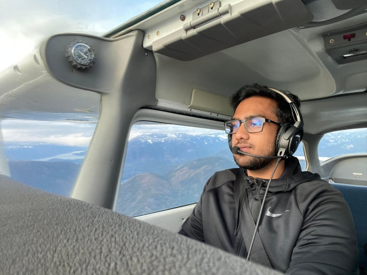 Man inside airplane cock pit