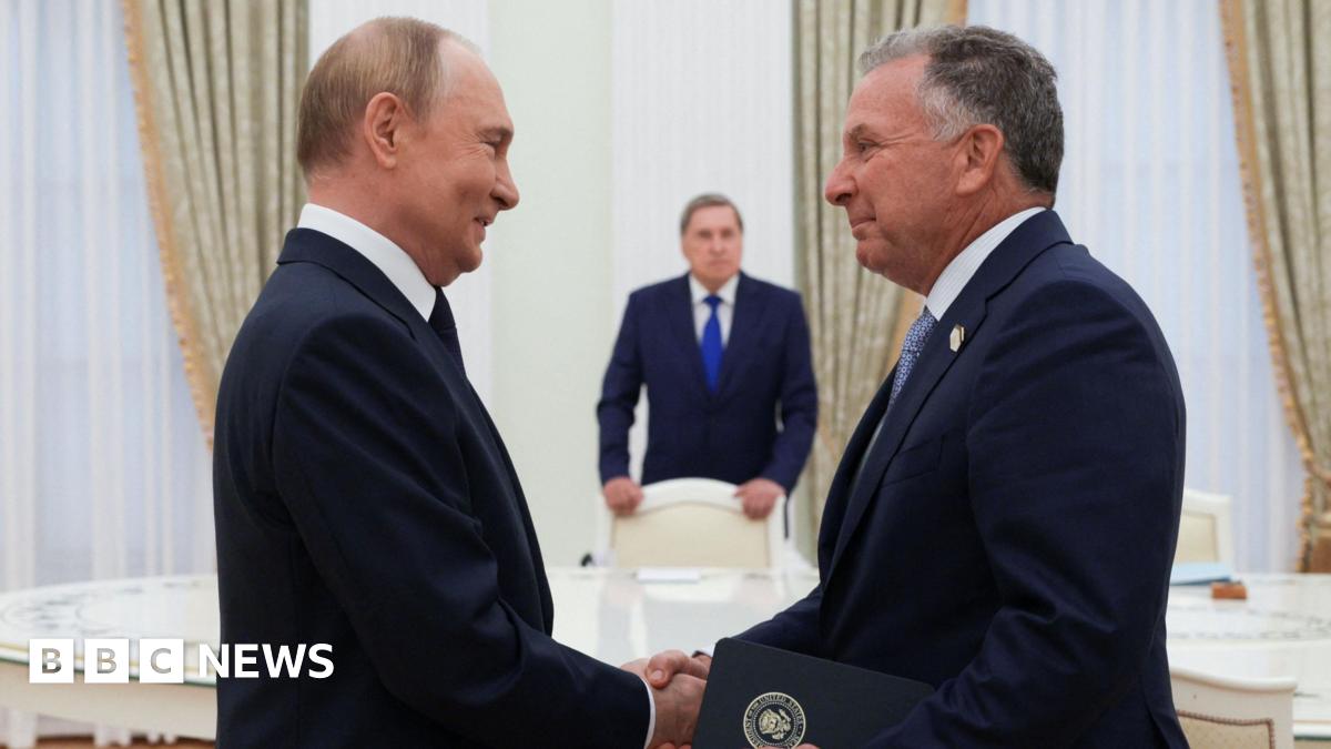 Putin and Witkoff shaking hands in a gilded room
