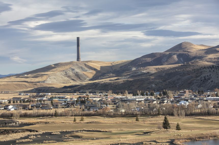 The Anaconda Smelter, which was in operation for 97 years before closing in 1980, looms in the background of this view of the town in 2019.