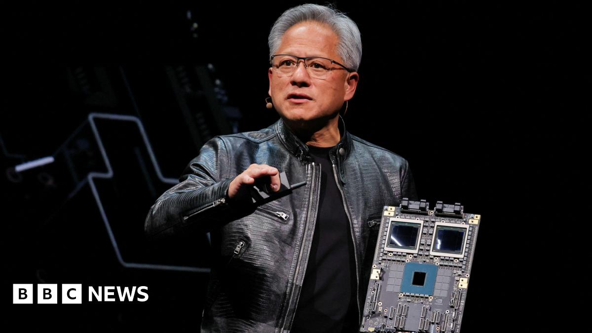 Nvidia chief executive Jensen Huang holding the Blackwell platform on stage at an event in Taiwan on 2 June, 2024.