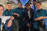 thumbnail: Harry Styles posing for a snap with the Aer Lingus crew who flew him over to Ireland.