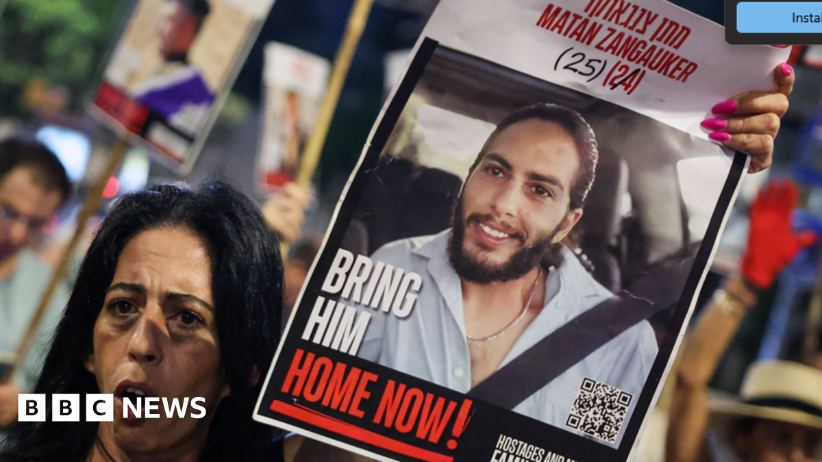Enav Zangauker holds a portrait of her kidnapped son, Matan, during an anti-government protest calling for action to secure the release of Israeli hostages held captive in Gaza.