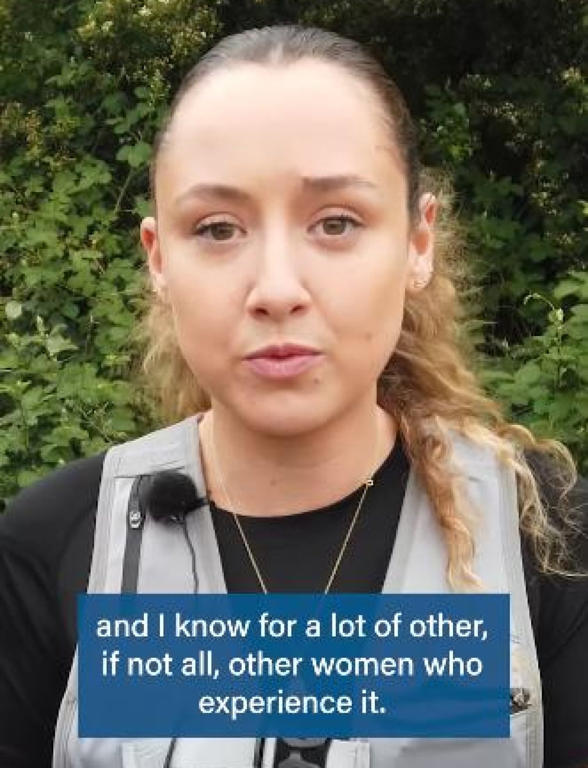 A still image shows  a  woman speaking toward the camera. A text overlay says 'and I know for a lot of other, if not all women, experience it.'