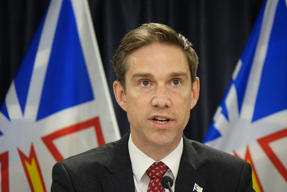 A man in a black suit.