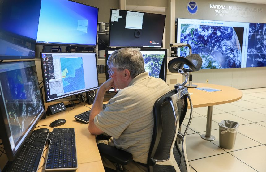 Jack Beven, senior hurricane specialist, tracks Erin on August 13 at the National Hurricane Center in Miami.
