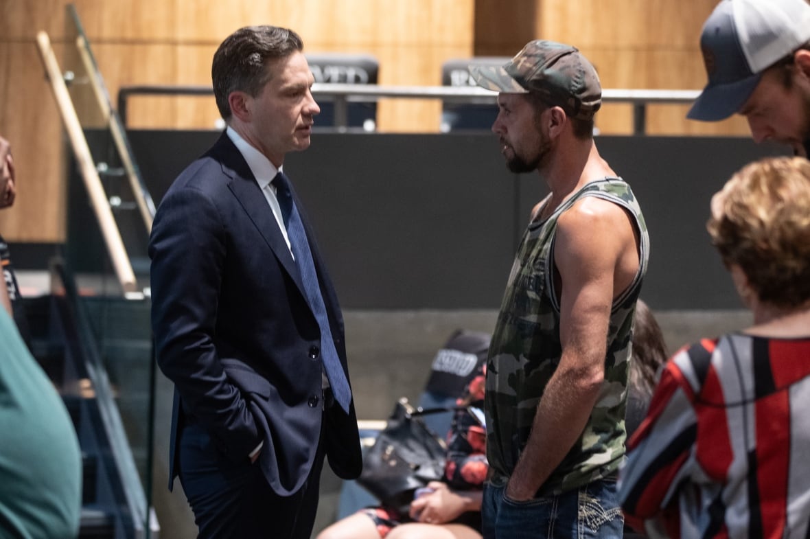 Conservative Party of Canada candidate Pierre Poilievre meets a supporter during a break at the Battle RiverÐCrowfoot byelection candidate forum in Camrose, Alat. on Tuesday, July 29, 2025.