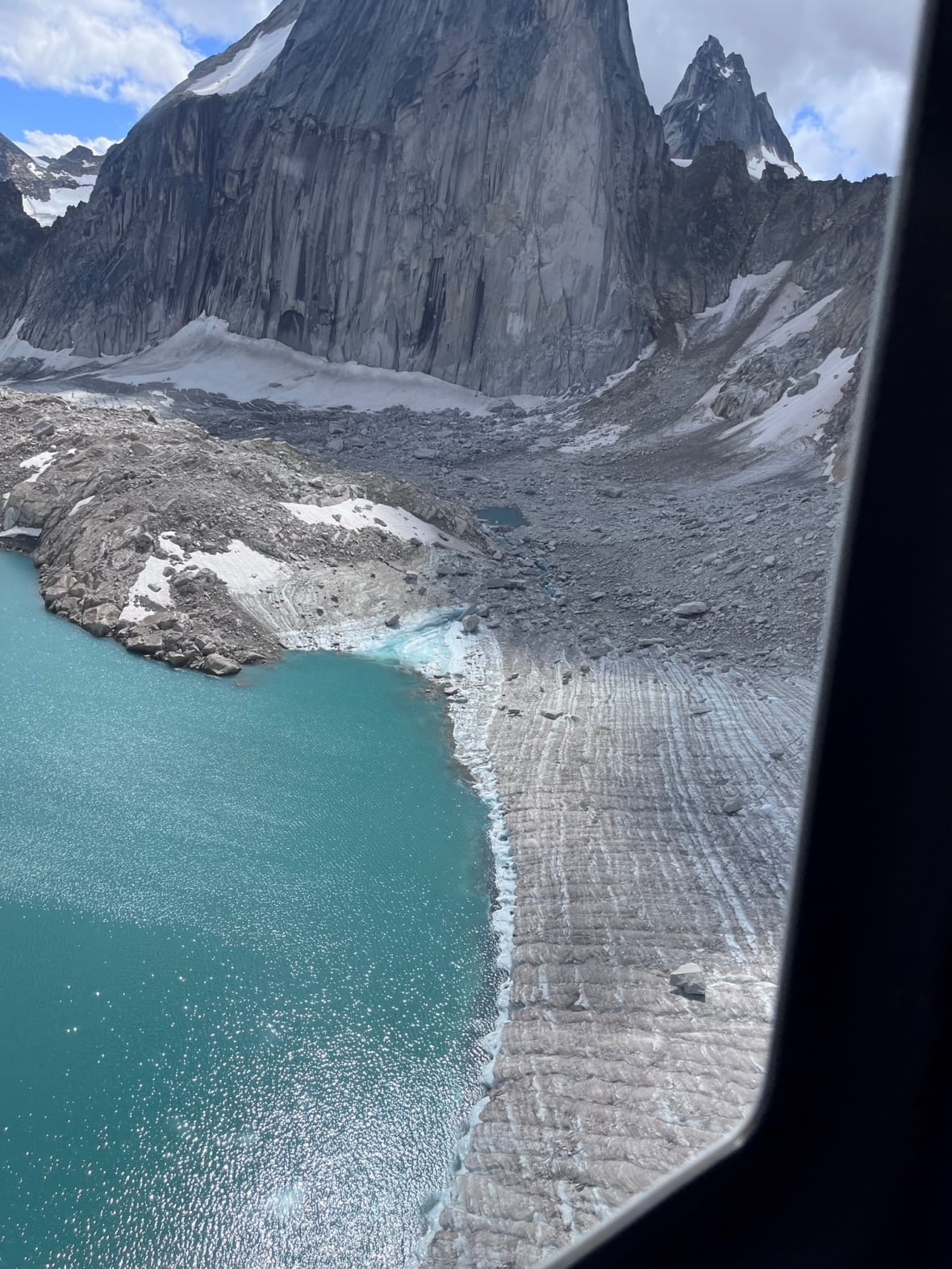 An alpine lake with a blockage on one side.