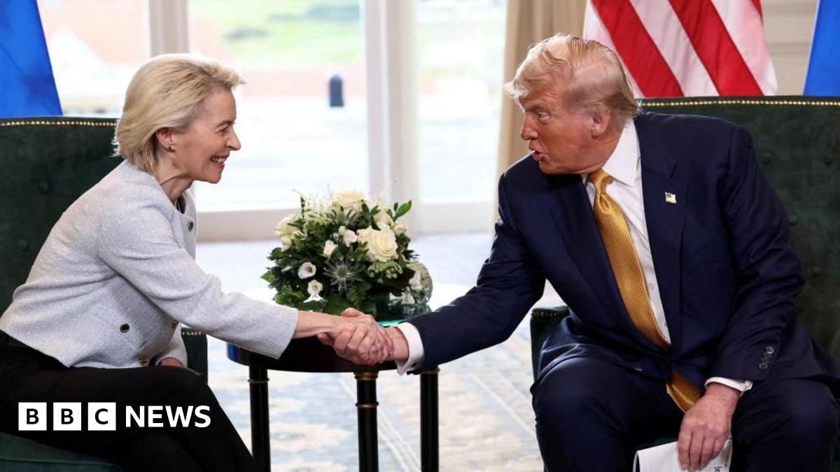 Ursuala von der Leyen and Donald Trump shake hands while seated.