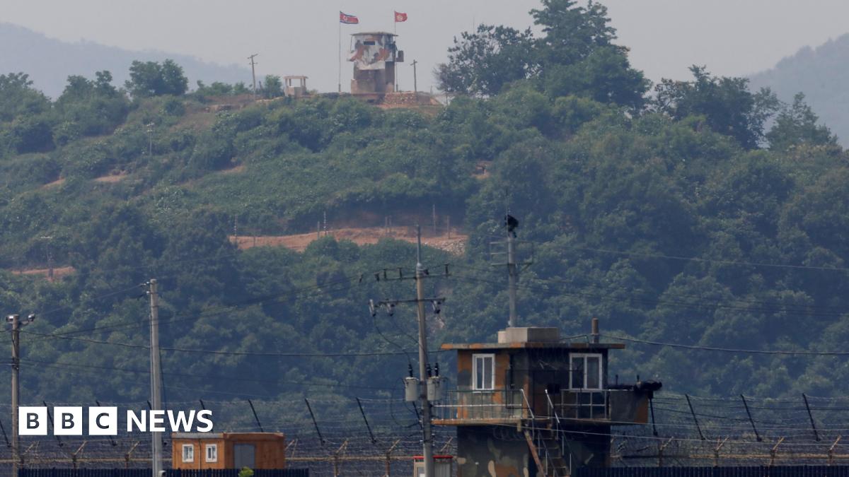 A North Korean soldier stands guard at his guard post inside North Korean territory, in this picture taken from Paju, South Korea, near the demilitarized zone (DMZ) separating the two Koreas