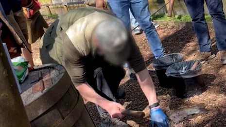 'Disturbing' undercover footage reveals apparent abuse of fish at Cotswolds farm – video