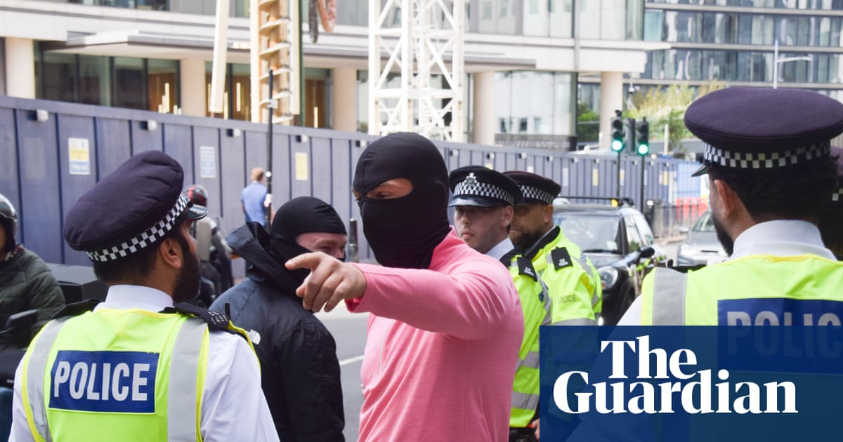 Police officer ‘punched in face’ as four arrested at London anti-asylum protest | UK news