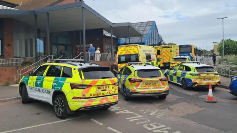 Police cars and ambulance vehicles are outside Queen Elizabeth Queen Mother Hospital in Margate.