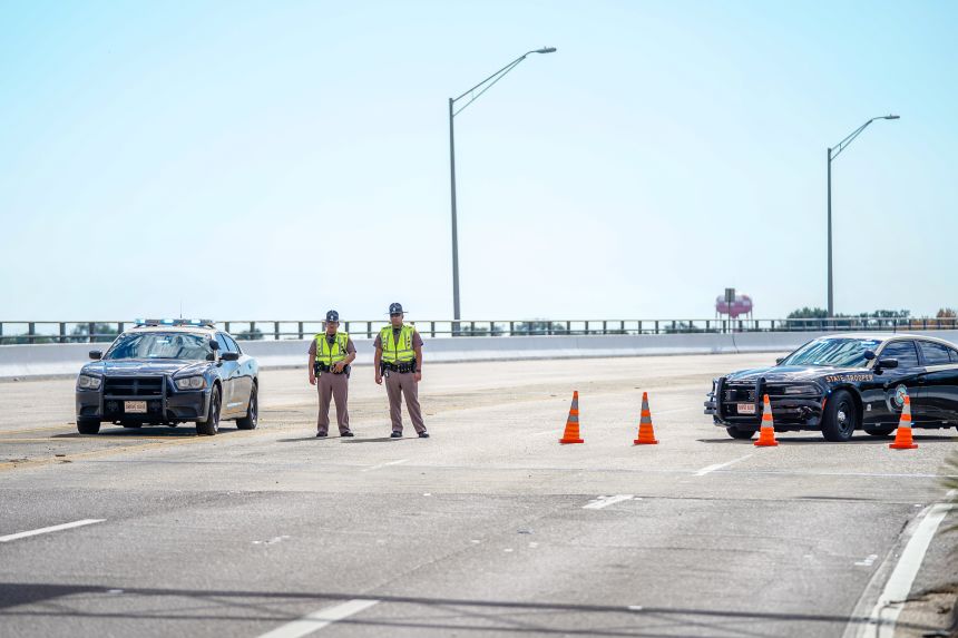 PENSACOLA, FLORIDA - DECEMBER 06: Florida State Troopers block traffic over the Bayou Grande Bridge leading to the Pensacola Naval Air Station following a shooting on December 06, 2019 in Pensacola, Florida. The second shooting on a U.S. Naval Base in a week has left three dead plus the suspect and seven people wounded.  (Photo by Josh Brasted/Getty Images)
