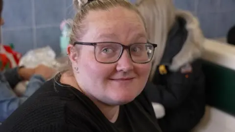 Elisha sitting in a fish and chip shop