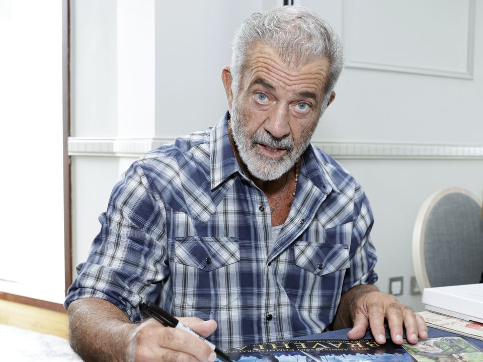 Mel Gibson signs posters in aid of the Irish Equity Support Fund (Conor O Mearain/PA)