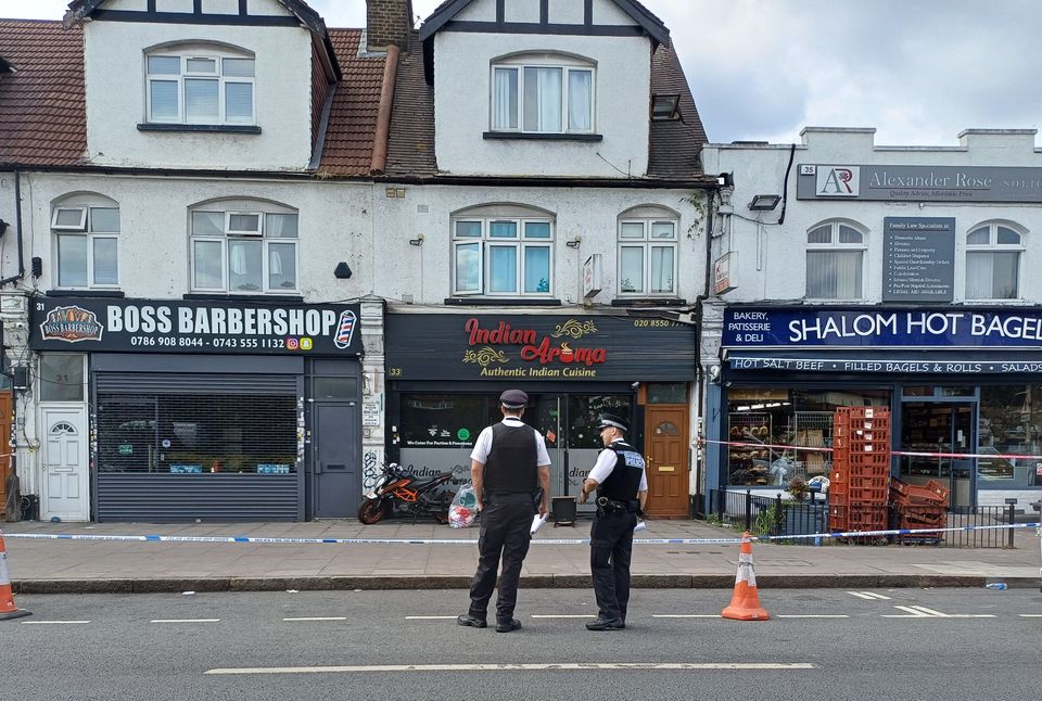 Police outside a restaurant in Ilford, east London (Helen William/PA)