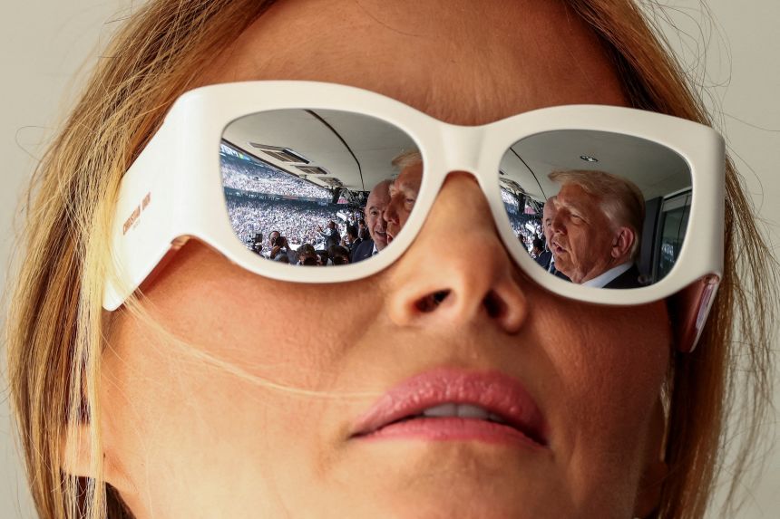 President Donald Trump and FIFA president Gianni Infantino are reflected on first lady Melania Trump's glasses, as they attend the FIFA Club World Cup final at the MetLife Stadium in East Rutherford, New Jersey on July 13.
