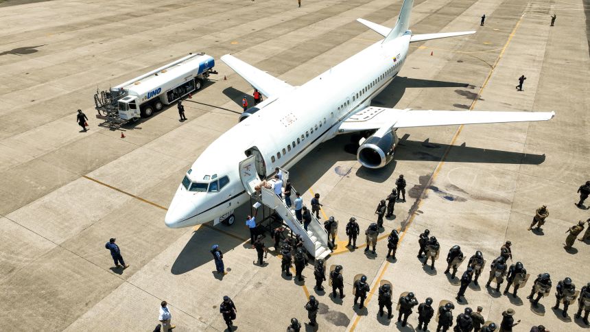 Venezuelan detainees are shown being sent home in a prison exchange for Americans held in Venezuela, according to El Salvador President Nayib Bukele, at El Salvador International Airport in San Luis Talpa, El Salvador, in this handout picture obtained by Reuters on July 18, 2025.
