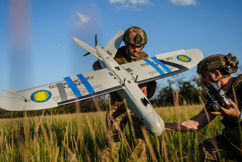 Ukrainian service members check a reconnaissance drone before its launch near a front line in Kharkiv region