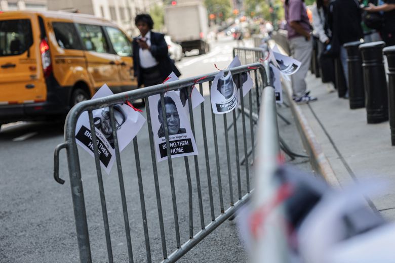 Fliers showing those arrested by ICE agents are displayed outside immigration court in Manhattan on July 24.