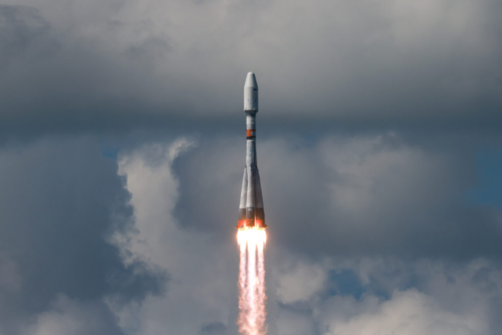 A Soyuz-2.1b rocket booster carrying satellites blasts off from its launchpad at the Vostochny Cosmodrome