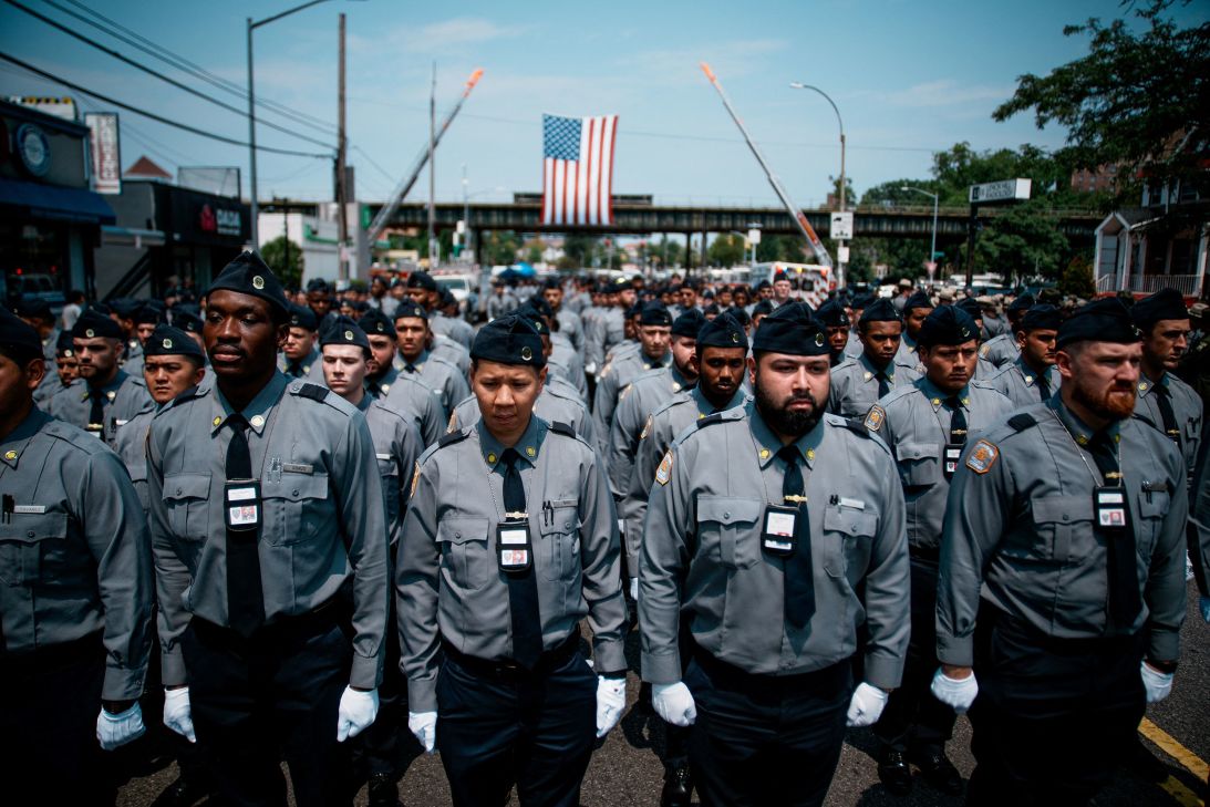 Police recruits stand in formation during the funeral services at the Parkchester Jame Masjid.