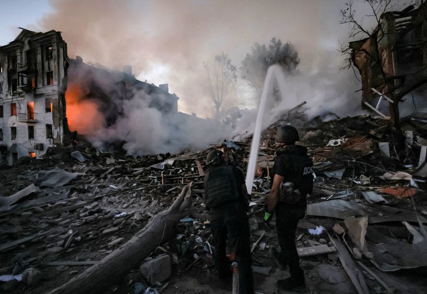 Firefighters work at the site of an apartment building in Kramatorsk in the Donetsk region of Ukraine that was hit by a Russian strike on July 31.