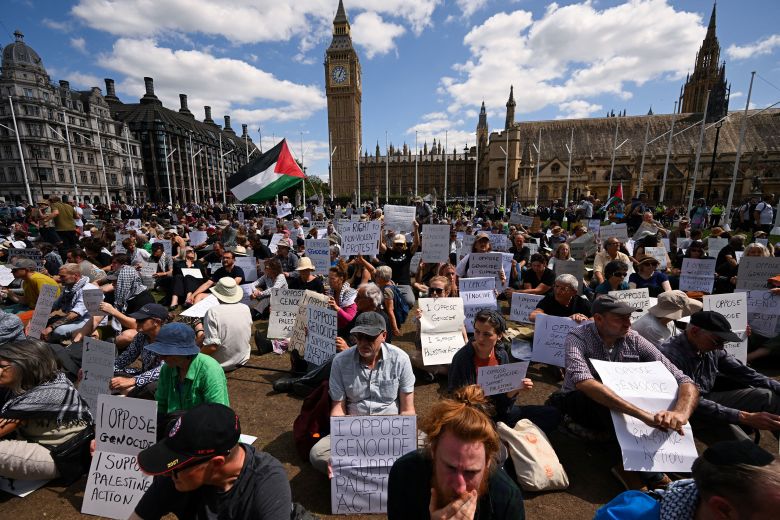 People attend a rally challenging the British government's proscription of the activist group Palestine Action in London on Saturday,