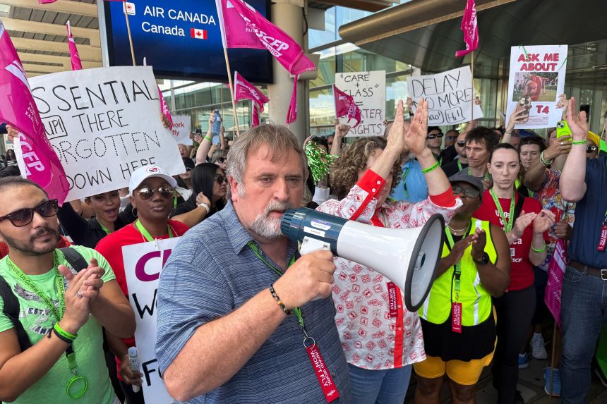 Mark Hancock, National President of the Canadian Union of Public Employees (CUPE), attends a picket line with striking Air Canada flight attendants at Toronto Pearson International Airport in Ontario, Canada, on Monday.