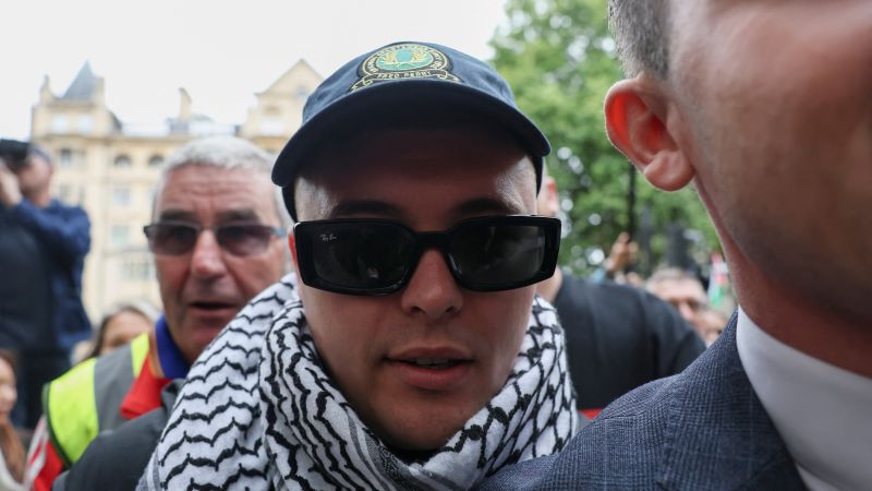 Hundreds of protesters turn up to support Irish rapper as he appears in court on terror charge