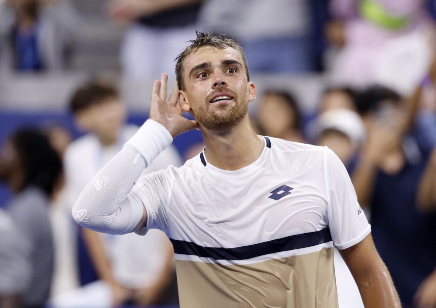 France's Benjamin Bonzi celebrates after winning his first round match against Russia's Daniil Medvedev at US Open in New York City on August 25.