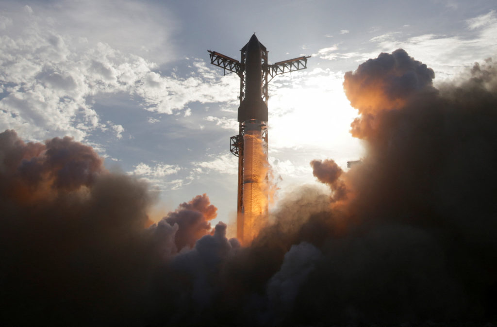 A SpaceX Super Heavy booster carrying the Starship spacecraft lifts off on its 10th test flight