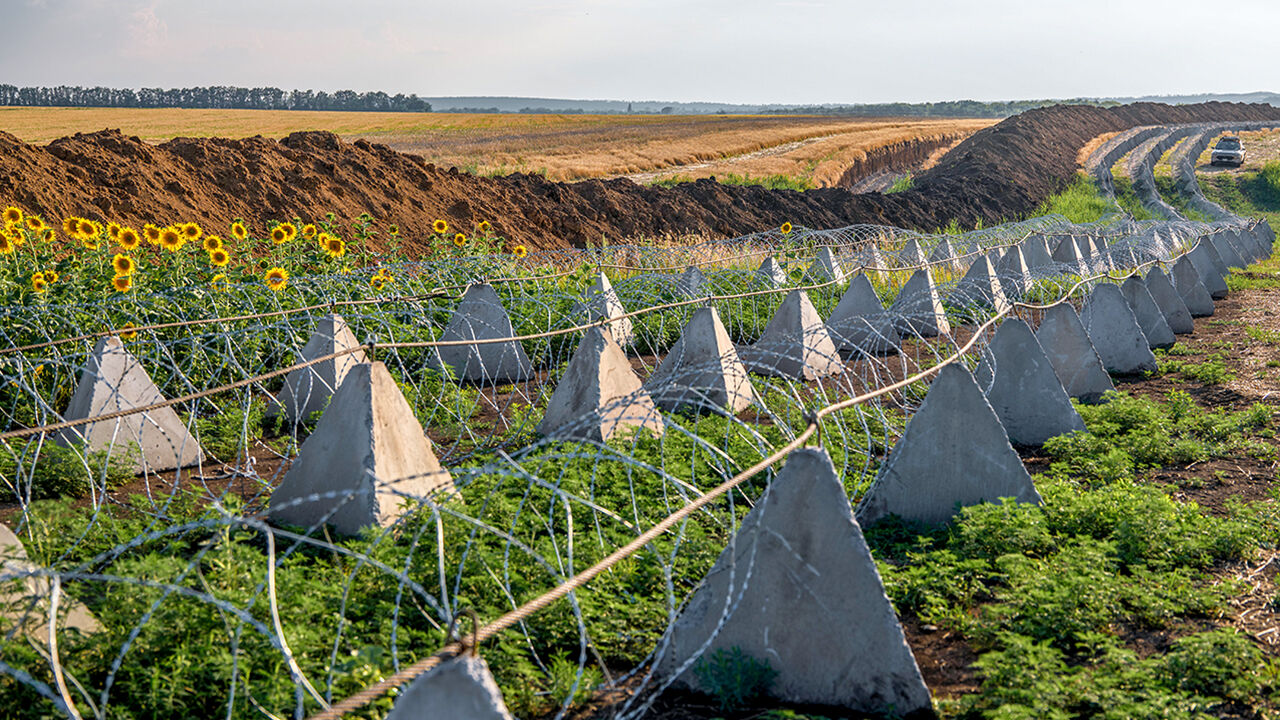 Ukrainian President Volodymyr Zelensky and US President Donald Trump both smiling during a meeting in the Oval Office of the White House in Washington, DC, USA.