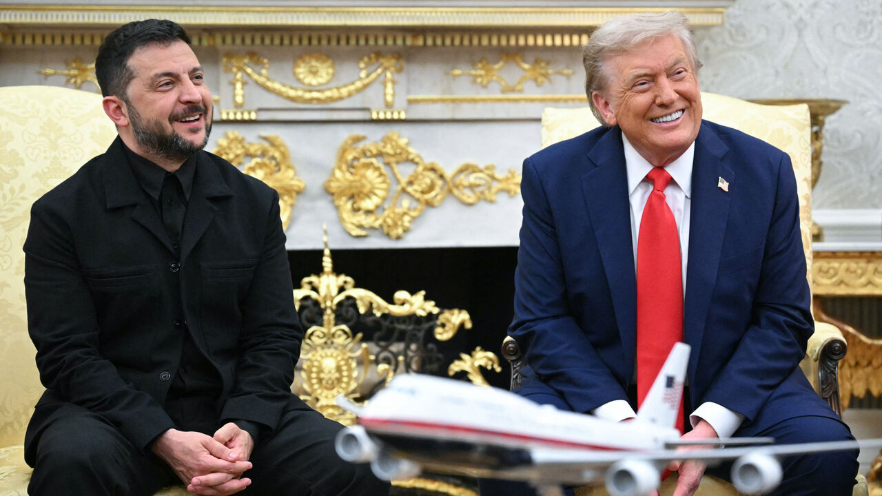 Ukrainian President Volodymyr Zelensky and US President Donald Trump both smiling during a meeting in the Oval Office of the White House in Washington, DC, USA.
