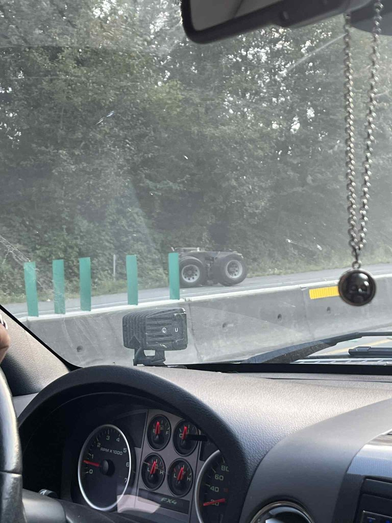 A piece of a crashed semi truck on the highway