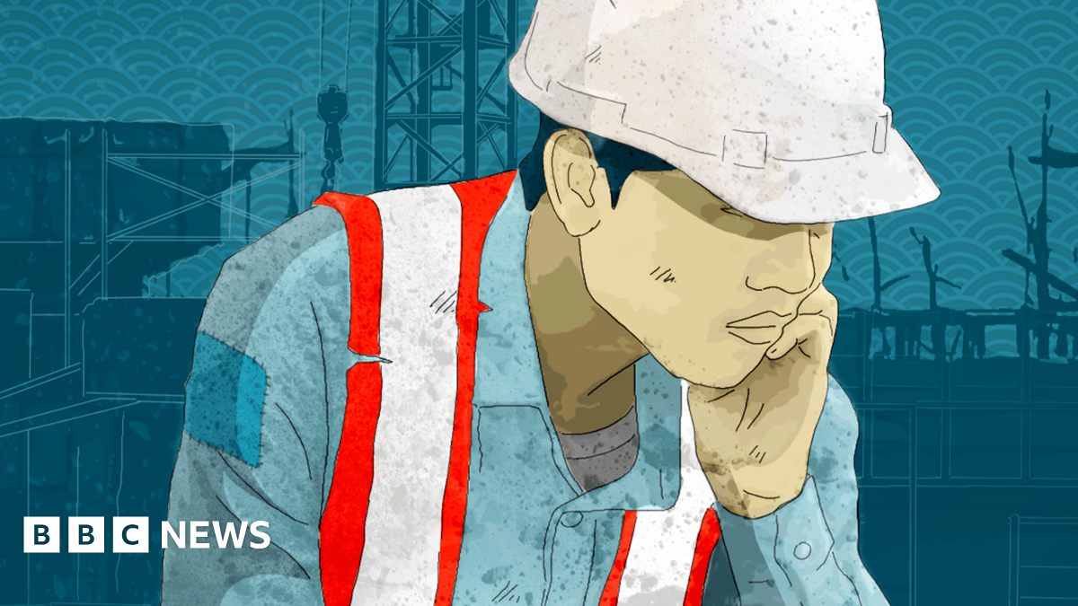 A graphic showing a North Korean worker in a hard hat and reflective vest with his head in his hands