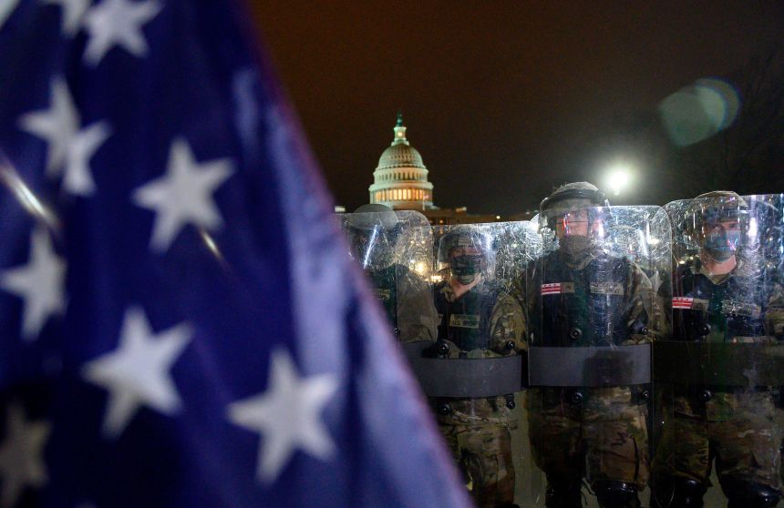 Members of the DC National Guard are deployed outside of the US Capitol in Washington DC on January 6, 2021. - Trump supporters remain outside, defying a 6.00 pm (2300 GMT) curfew imposed across the city by Mayor Muriel Bowser.
Donald Trump's supporters stormed a session of Congress held today, January 6, to certify Joe Biden's election win, triggering unprecedented chaos and violence at the heart of American democracy and accusations the president was attempting a coup.