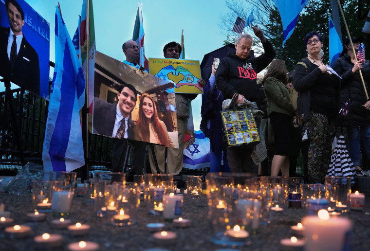 Mourners gather for a vigil 