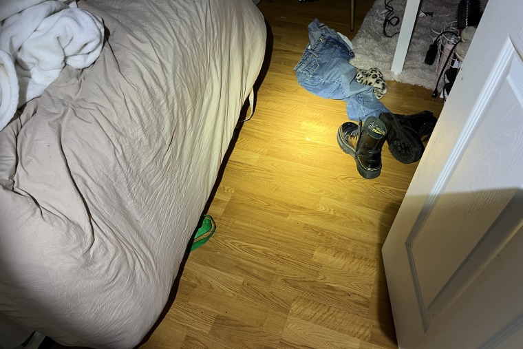 Showing leading into the room Kaylee/Maddie were in, but just see door, end of bed and shoes on the floor/blanket on chair.